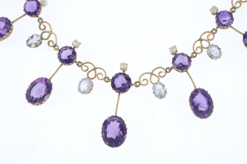 An early 20th century gold amethyst and aquamarine fringe necklace. Designed as a graduated series - Image 2 of 4