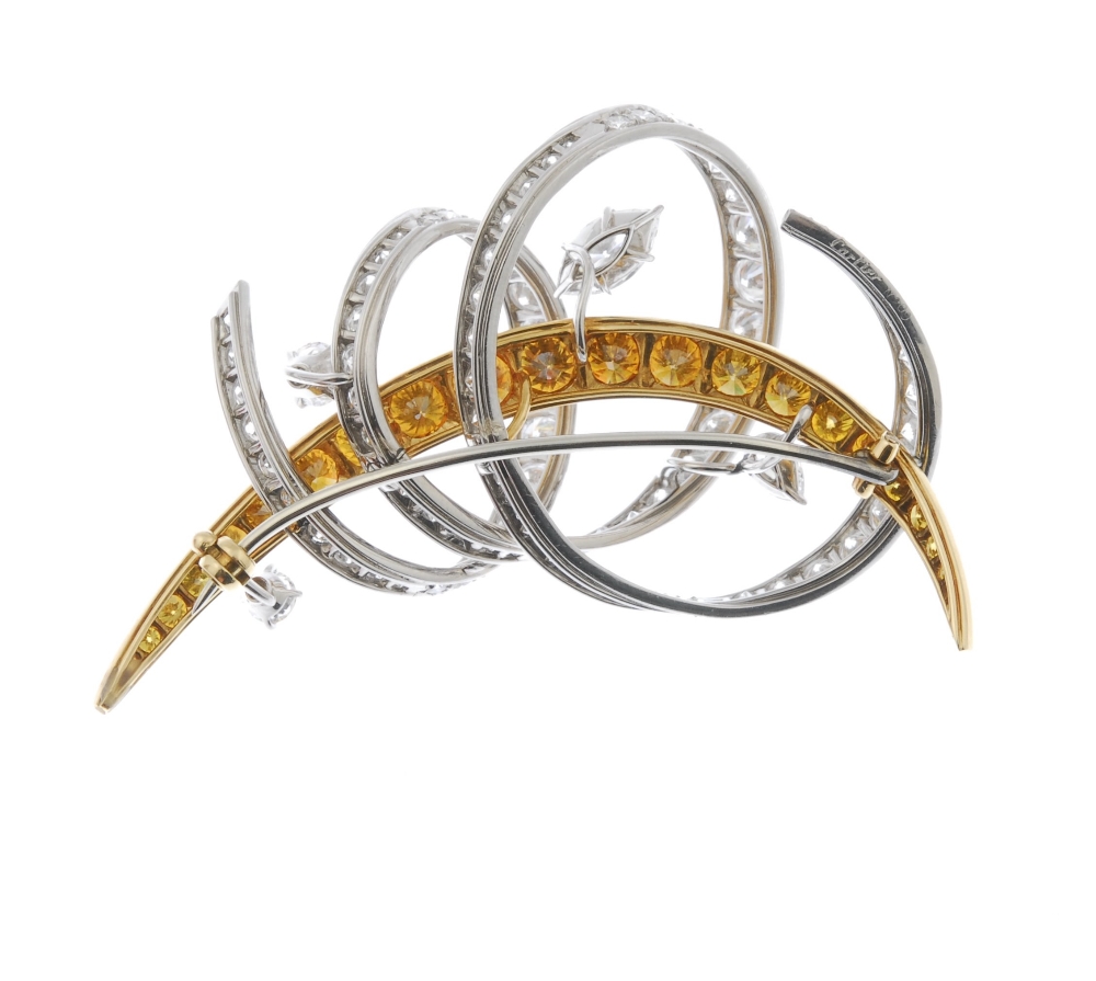 CARTIER - a coloured diamond and diamond brooch. Designed as a graduated fancy 'yellow' brilliant- - Image 2 of 5