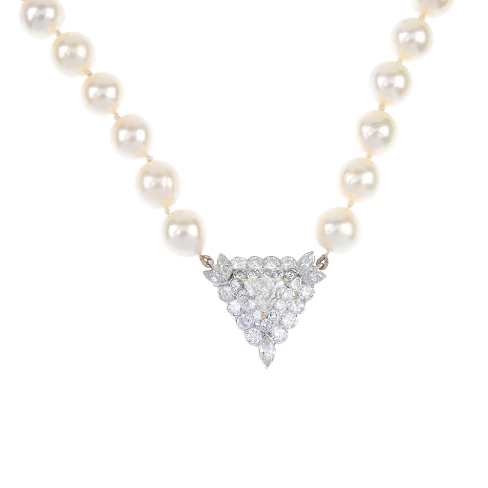 A diamond and cultured pearl single-strand necklace. The triangular-shape diamond, weighing 0.