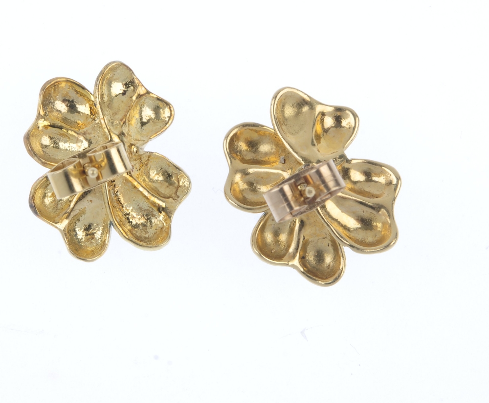 A pair of diamond and enamel floral ear studs. Each designed as a blue enamel flower, with - Image 3 of 3