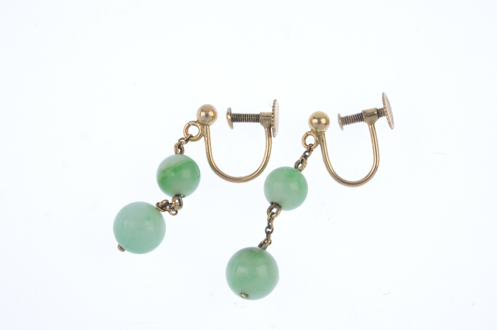 A pair of jade ear pendants. Each designed as two graduated jadeite beads, suspended along a trace- - Image 2 of 2