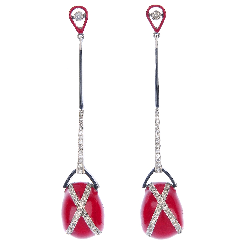 A pair of diamond and enamel ear pendants. The pear-shape red enamel drop, with brilliant-cut