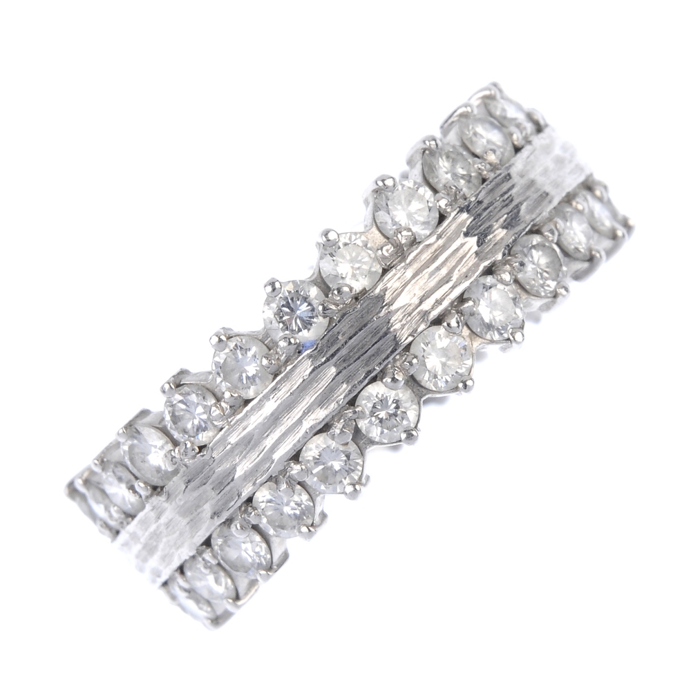 BOODLES & DUNTHORNE - a platinum diamond dress ring. Designed as a bark effect band, with