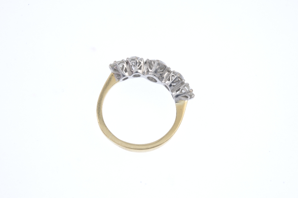 An 18ct gold diamond five-stone ring. The graduated old-cut diamond line, to the plain band. - Image 4 of 4