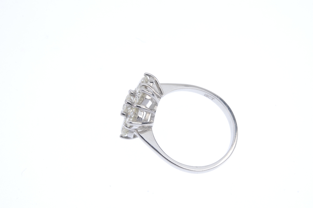 A diamond cluster ring. The brilliant-cut diamond, within a similarly-cut diamond surround, to the - Image 3 of 4