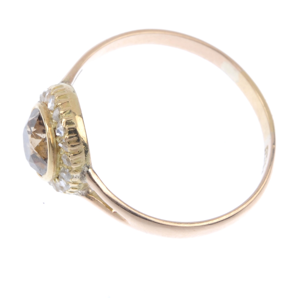 A coloured diamond and diamond cluster ring. The old-cut 'brown' diamond, within a rose-cut - Image 3 of 4