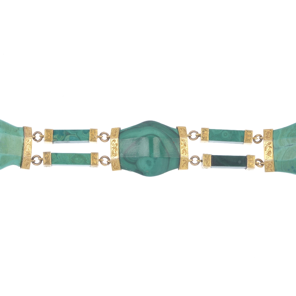 A late Victorian gold malachite bracelet, circa 1880. Designed as a series of curved malachite