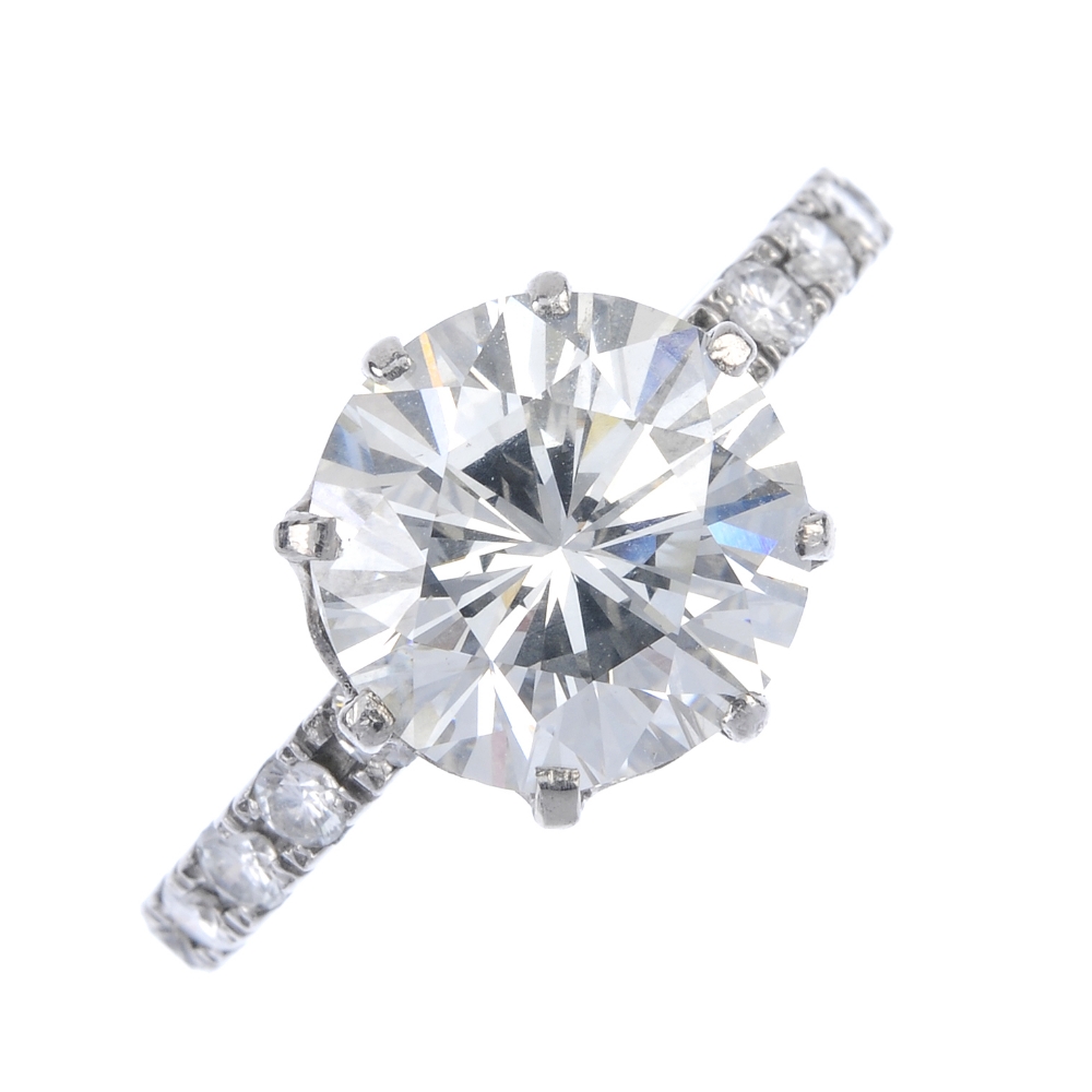 A diamond single-stone ring. The brilliant-cut diamond, weighing 4.69cts, to the similarly-cut