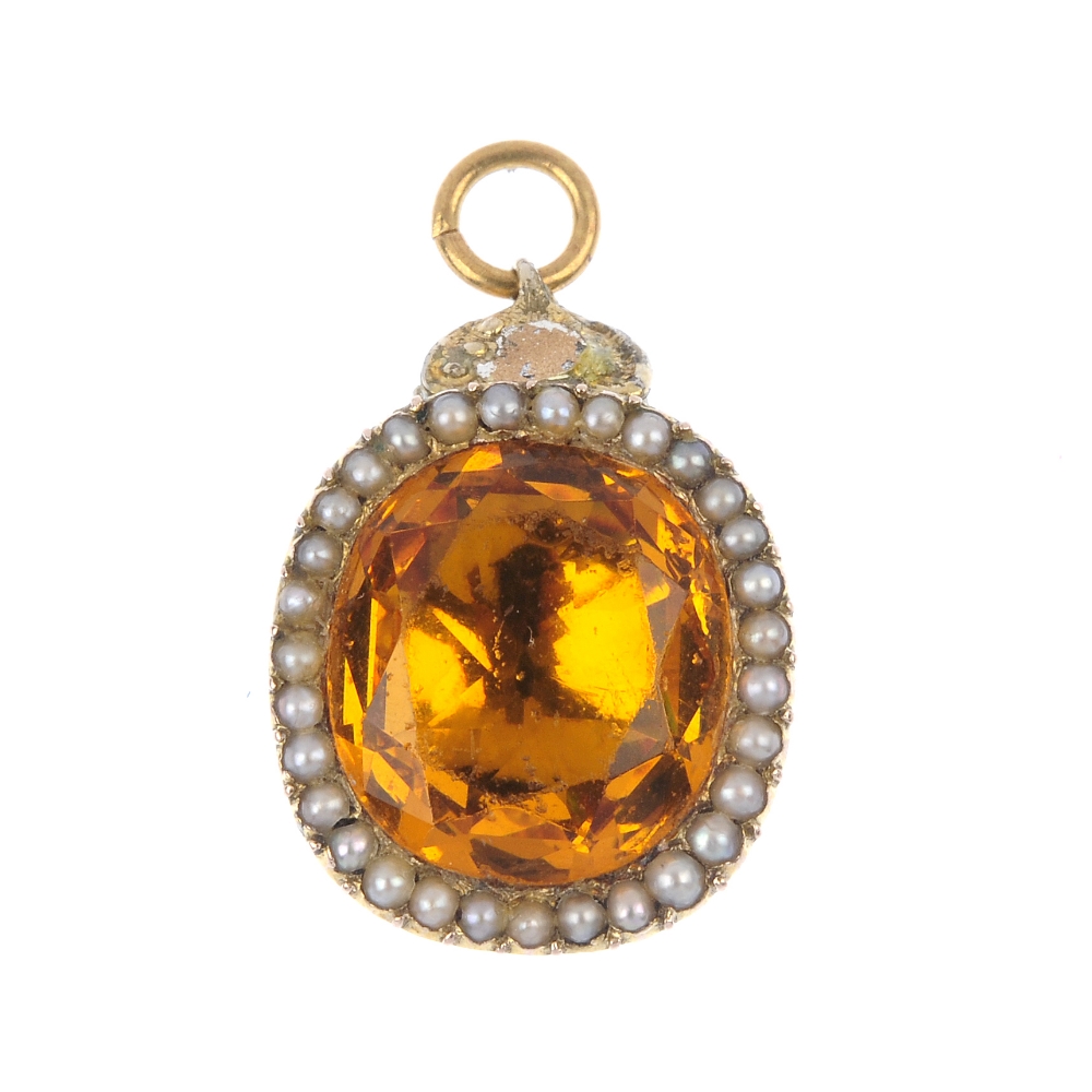 A mid 19th century citrine and split pearl pendant. The cushion-shape foil back citrine, within a