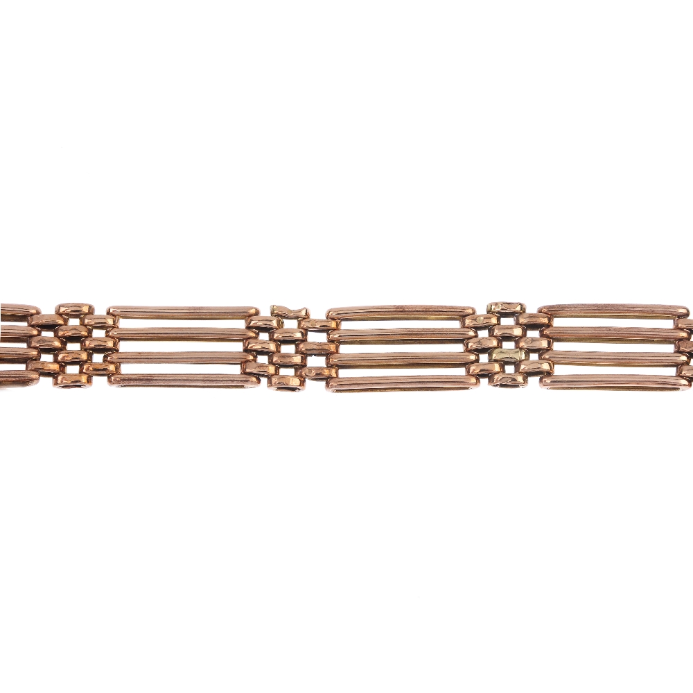 An early 20th century 9ct gold bracelet. Designed as a series of alternating gate and brick-links,