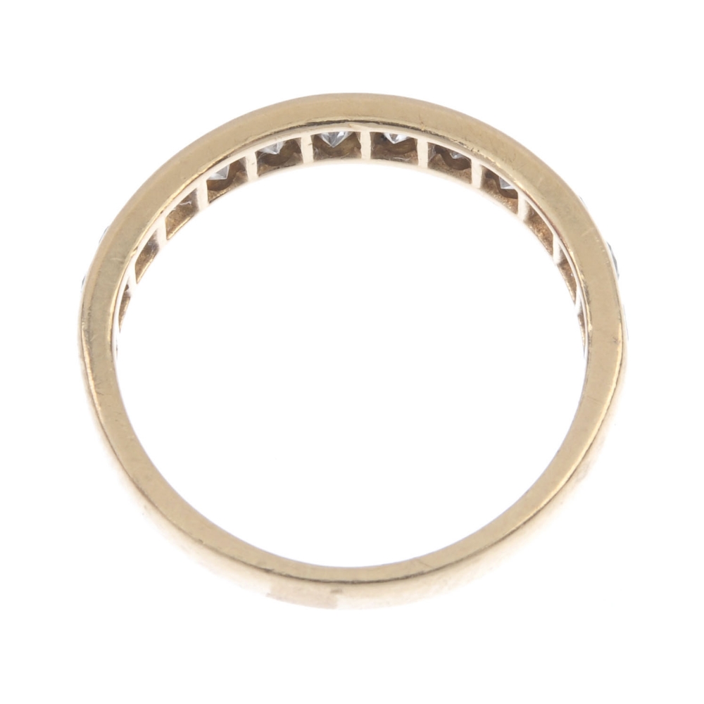 A diamond half-circle eternity ring. The brilliant-cut diamond line, inset to the plain band. - Image 3 of 3