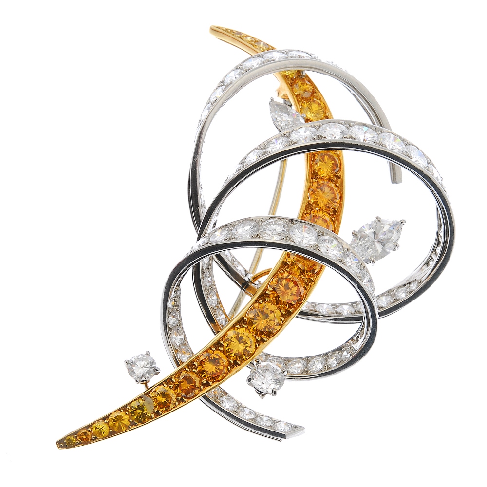 CARTIER - a coloured diamond and diamond brooch. Designed as a graduated fancy 'yellow' brilliant-