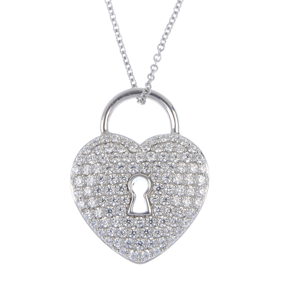 TIFFANY & CO. - a diamond 'lock' pendant. Designed as a pave-set diamond heart lock, with openwork