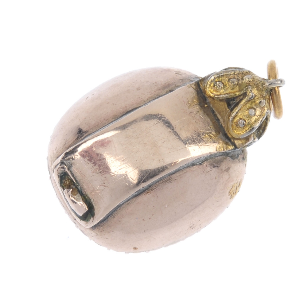 A mid 19th century citrine and split pearl pendant. The cushion-shape foil back citrine, within a - Image 2 of 2