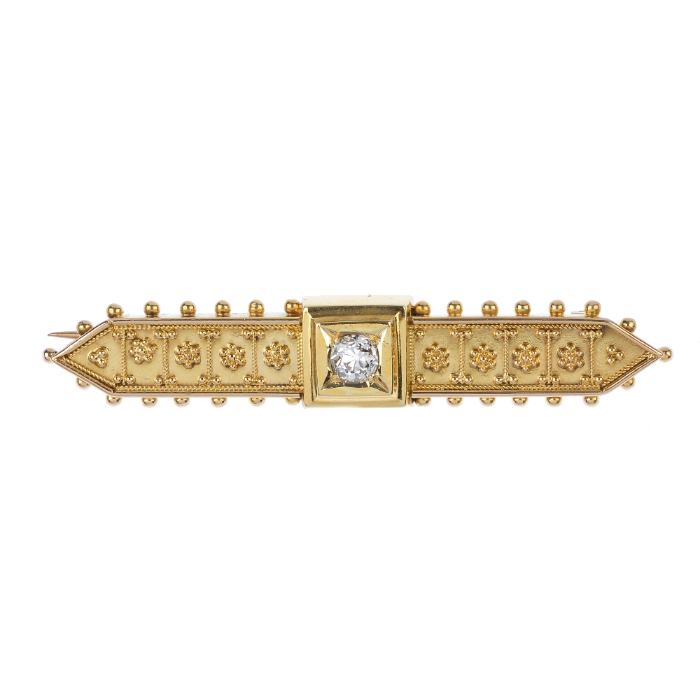 A late 19th century gold diamond brooch. The old-cut diamond, to the cannetille sides and bead edge.