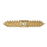 A late 19th century gold diamond brooch. The old-cut diamond, to the cannetille sides and bead edge.