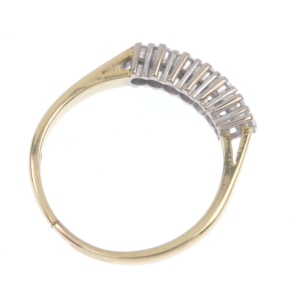 An 18ct gold diamond seven-stone ring. The brilliant-cut diamond line, to the plain band. - Image 4 of 4