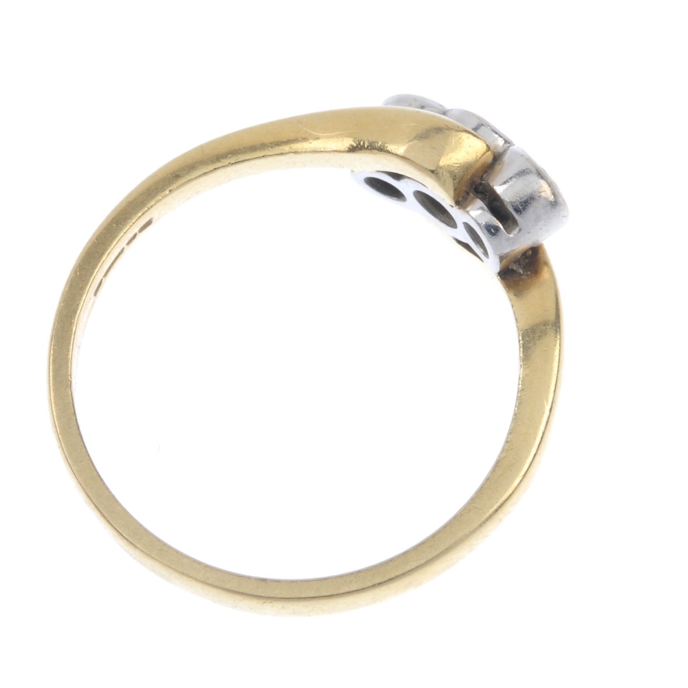 An 18ct gold diamond three-stone crossover ring. The graduated brilliant-cut diamond collets, to the - Image 4 of 4