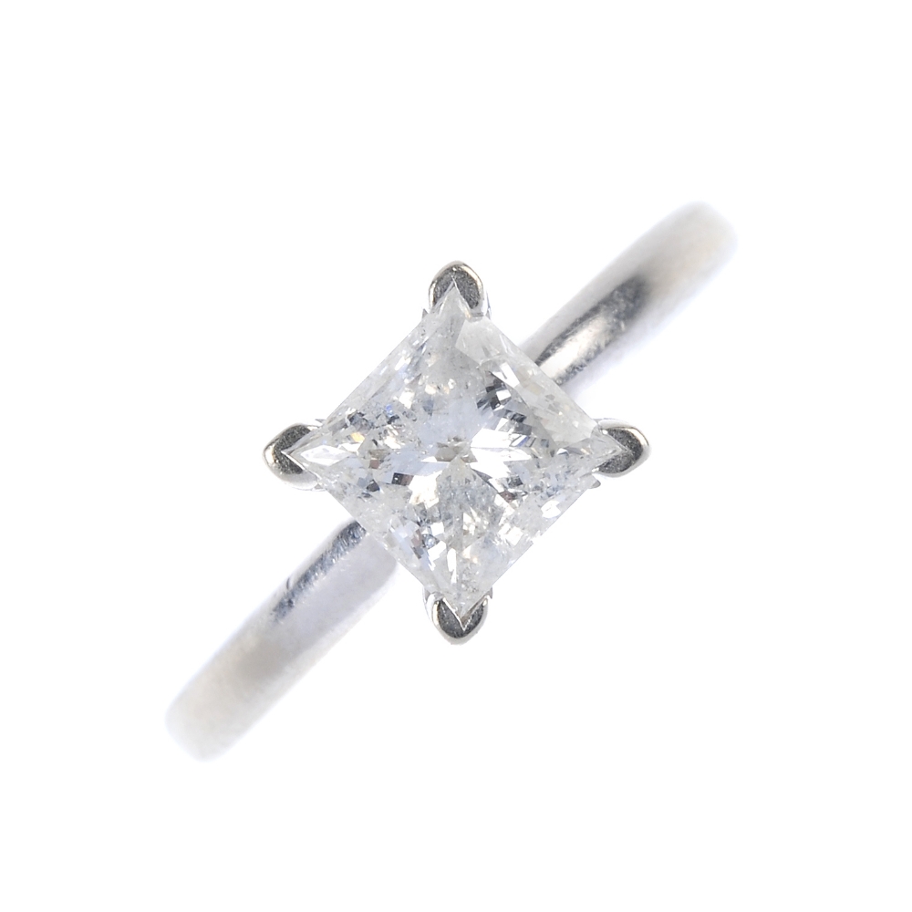 A diamond single-stone ring. The square-shape diamond, to the plain band. Diamond weight 1.04ct,