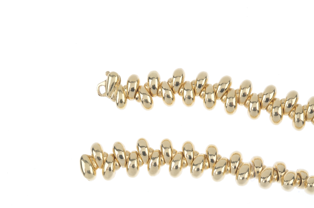 An 18ct gold collar. Designed as a series of tapered links, set at alternating orientations, to - Image 3 of 3