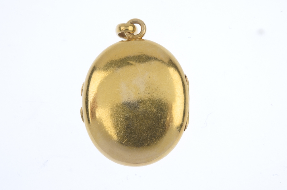 A late 19th century 18ct gold diamond and enamel locket. The rose-cut diamond floral motif, atop a - Image 2 of 3