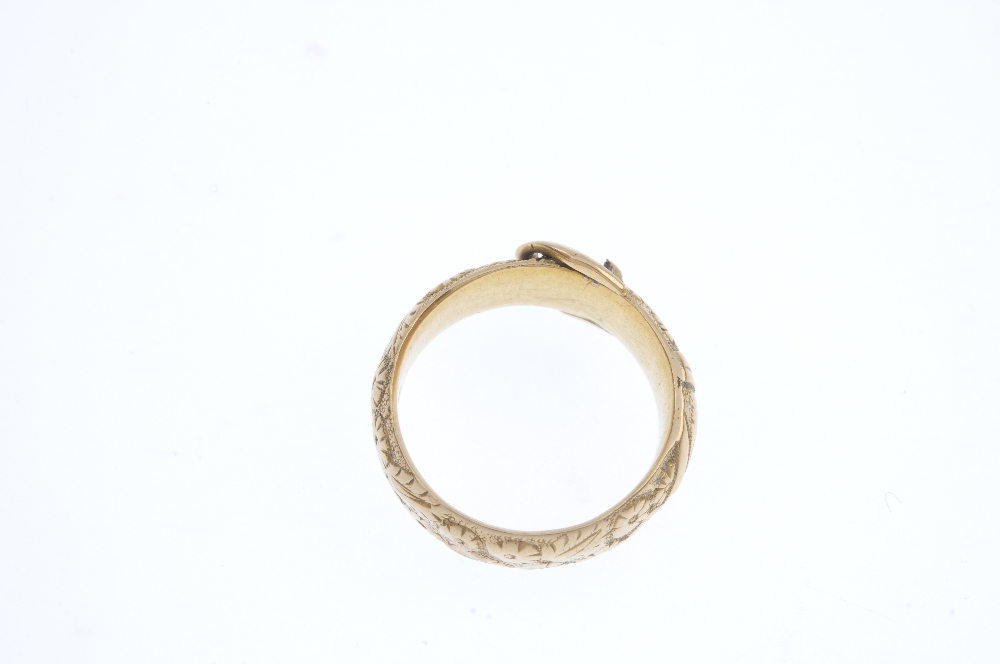 A late Victorian 18ct gold buckle ring. Designed as a belt, with floral texture. Hallmarks for - Image 3 of 3