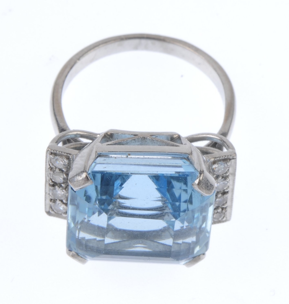 An aquamarine and diamond dress ring. The square-shape aquamarine, to the brilliant-cut diamond line - Image 3 of 3