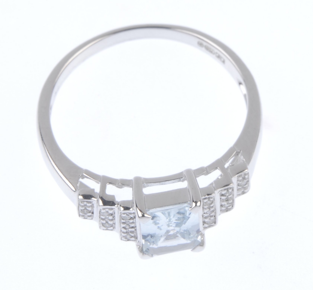 An 18ct gold aquamarine and diamond ring. The rectangular-shape aquamarine, to the single-cut - Image 2 of 4
