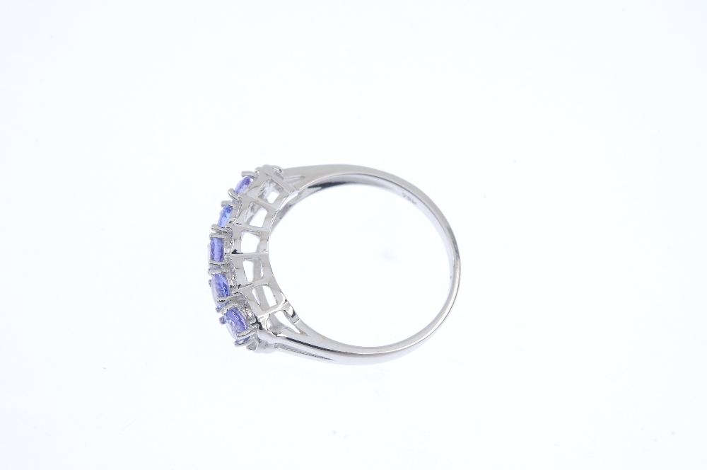 An 18ct gold tanzanite and diamond ring. The oval-shape tanzanite line, to the single-cut diamond - Image 3 of 4