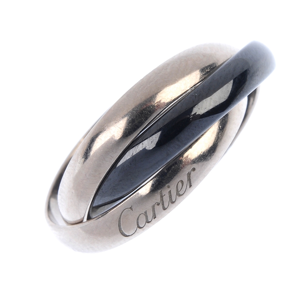 CARTIER - an 18ct gold ceramic 'Trinity' ring. Of bi-colour design, comprising three interwoven