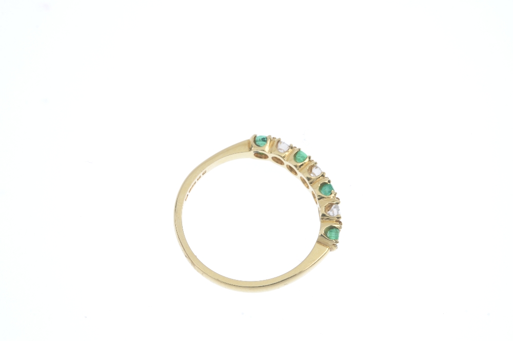 An 18ct gold emerald and diamond seven-stone ring. The alternating brilliant-cut diamond and - Image 4 of 4