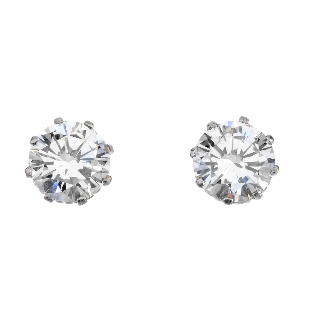 A pair of brilliant-cut diamond ear studs, weighing 2.02 and 2.04cts, respectively. Accompanied by