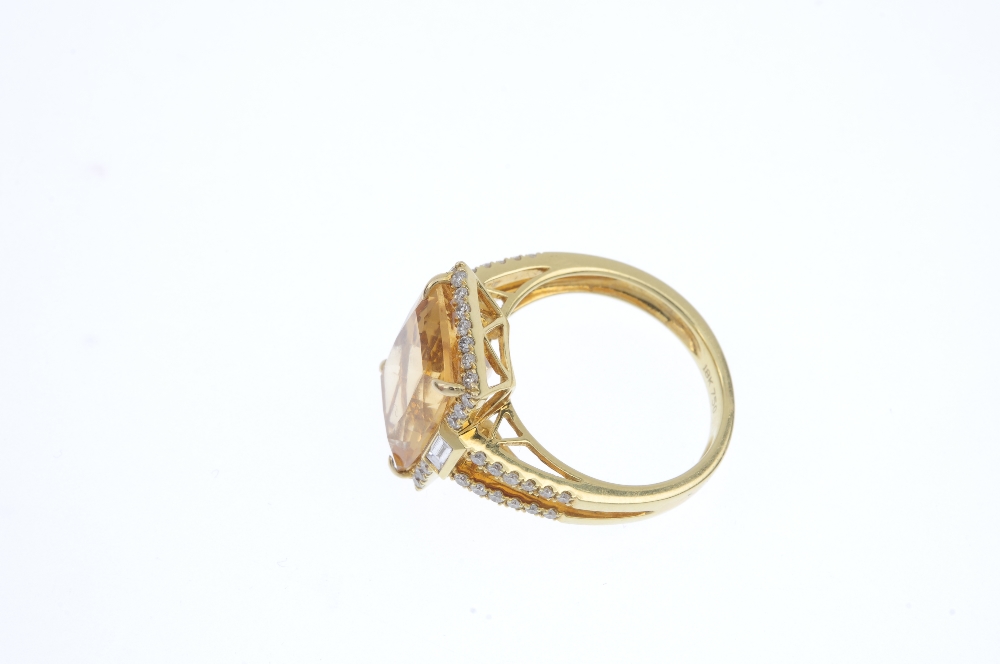 A citrine and diamond dress ring. The rectangular-shape citrine, within a brilliant-cut diamond - Image 3 of 4