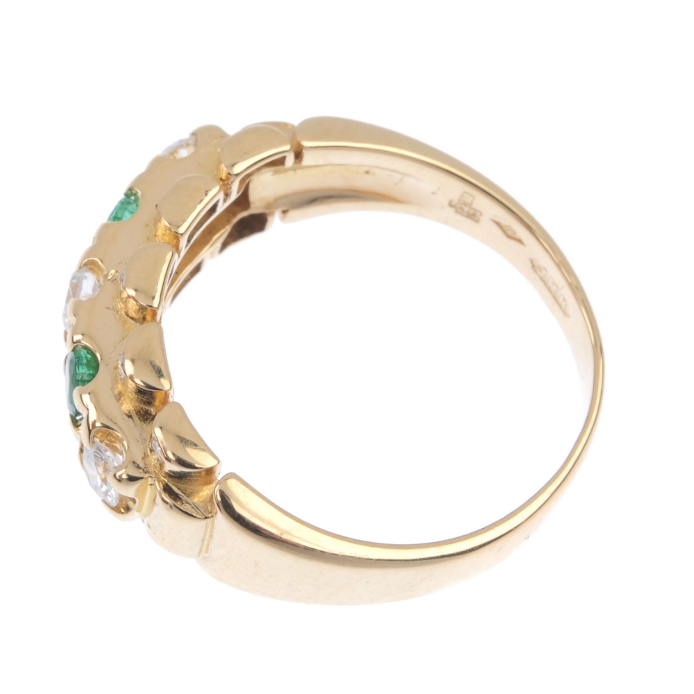 An 18ct gold emerald and diamond dress ring. The alternating brilliant-cut diamond and circular- - Image 3 of 4