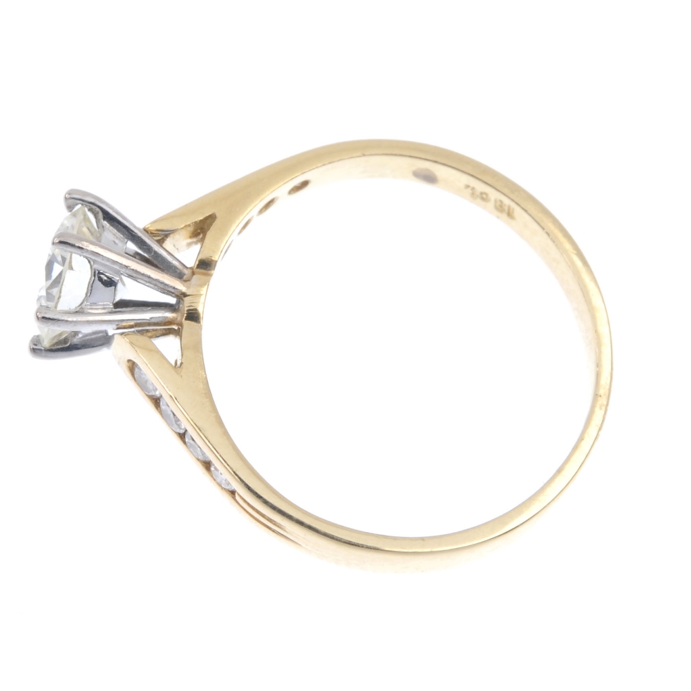 A diamond single-stone ring. The brilliant-cut diamond, raised to the graduated similarly-cut - Image 3 of 4