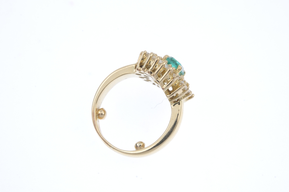 An emerald and diamond cluster ring. The rectangular-shape emerald, within a baguette and - Image 4 of 4