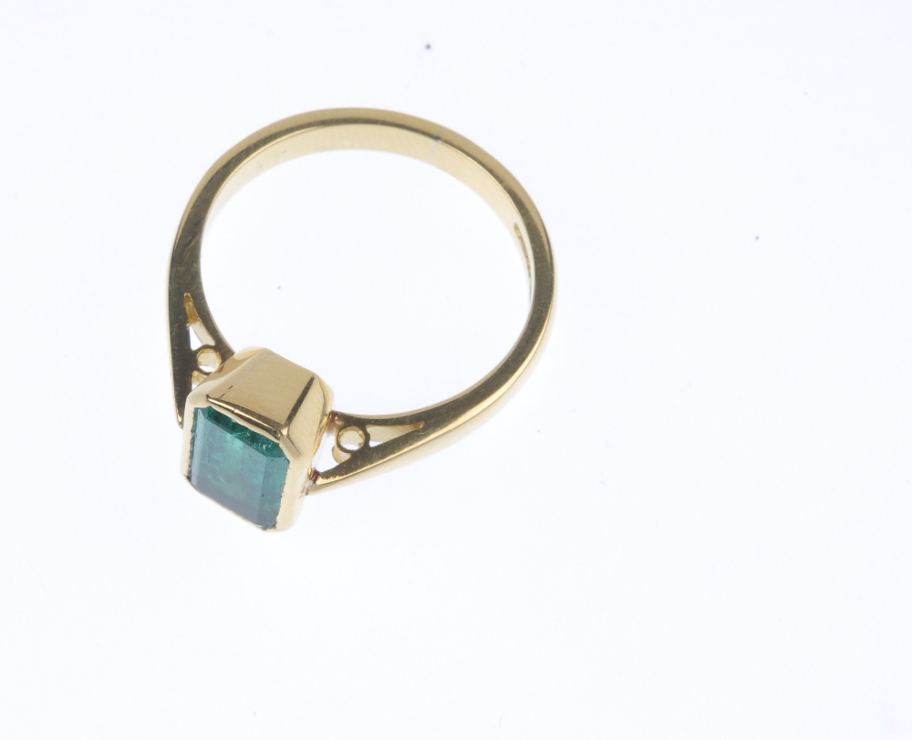 An 18ct gold emerald single-stone ring. The rectangular-shape emerald collet, to the tapered - Image 2 of 5
