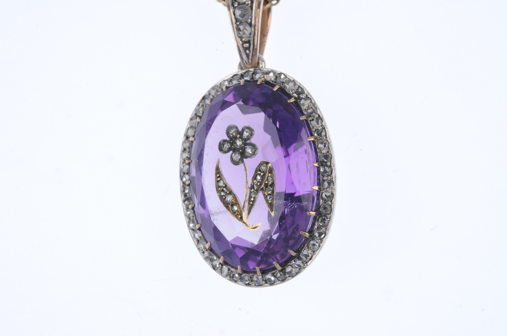 An early 20th century silver and gold, amethyst and diamond pendant. The oval-shape amethyst with - Image 2 of 4