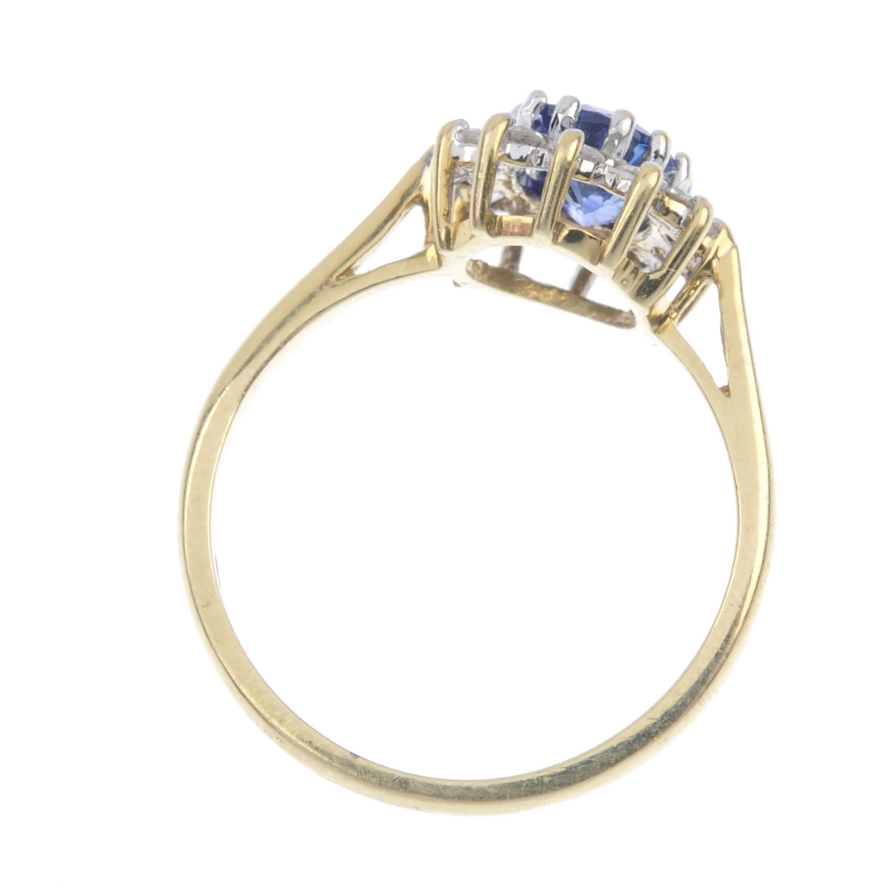An 18ct gold sapphire and diamond cluster ring. The oval-shape sapphire, within a brilliant-cut - Image 4 of 4