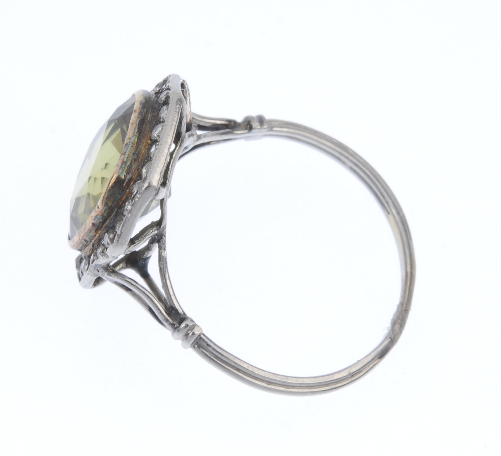 A mid 20th century chrysoberyl and diamond cluster ring. The cushion-shape yellowish green - Image 3 of 4