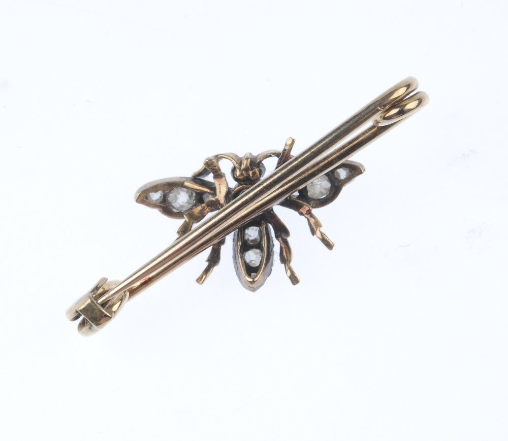 A diamond and ruby insect brooch. The old and rose-cut diamond body and wings, with ruby cabochon - Image 2 of 2