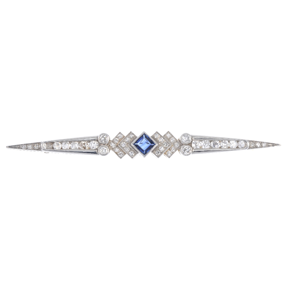 A sapphire and diamond bar brooch. The square-shape sapphire, to the single-cut diamond chevrons and