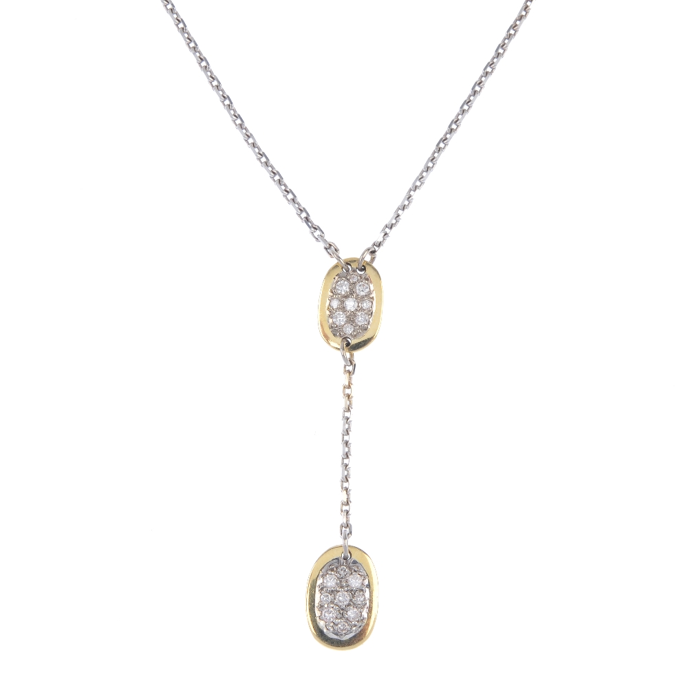 A diamond pendant. Designed as a pave-set brilliant-cut diamond oval-shape disc, suspending a