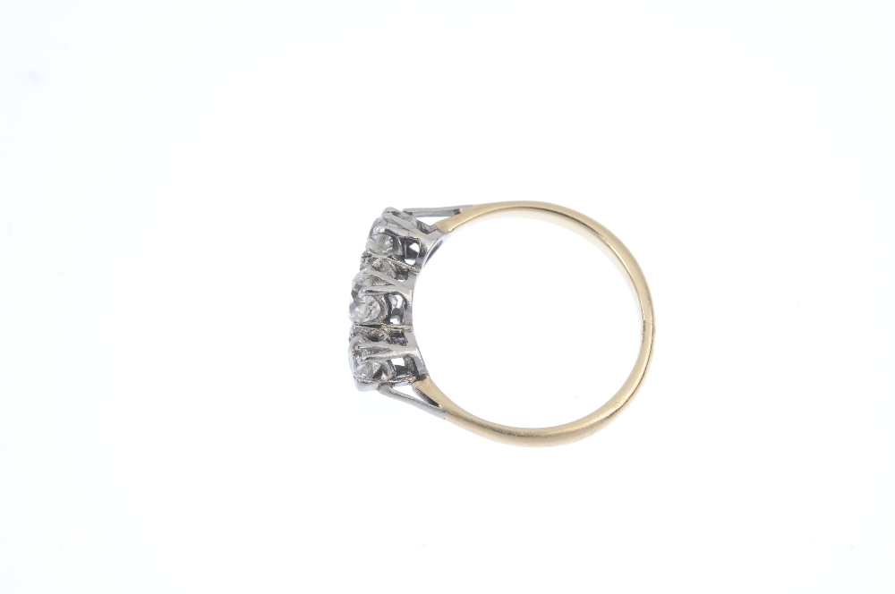 A diamond three-stone ring. The old-cut diamond, with similarly-cut diamond sides, to the plain - Image 3 of 4
