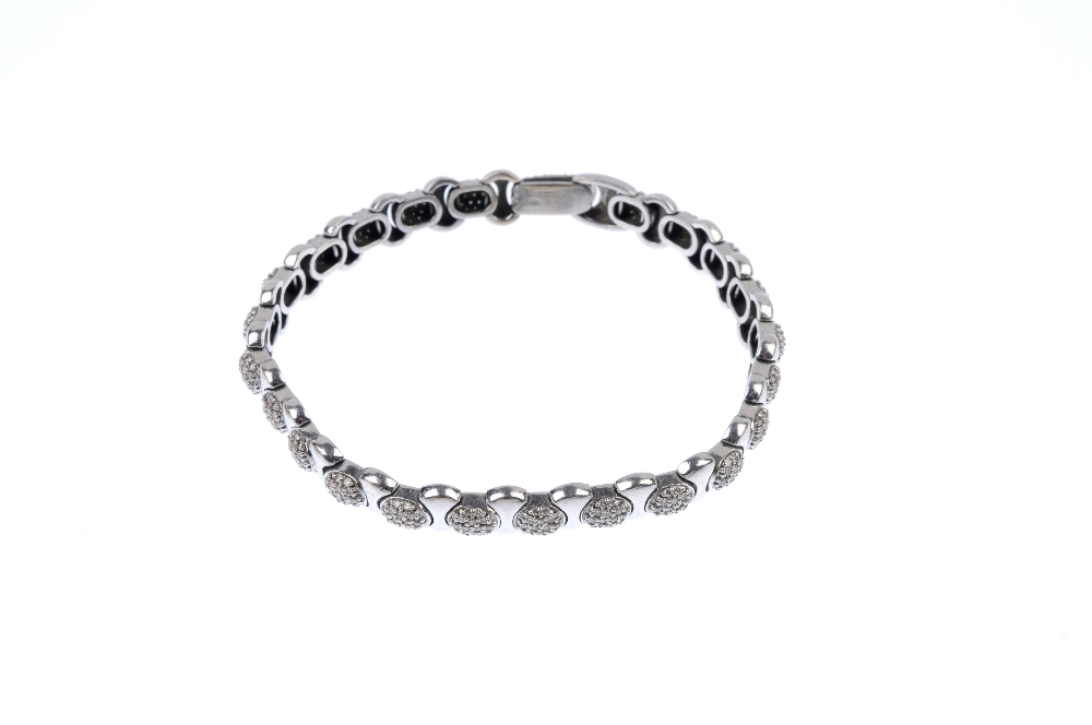 An 18ct gold diamond bracelet. Designed as a series of pave-set diamond links, with curved-link - Image 4 of 4