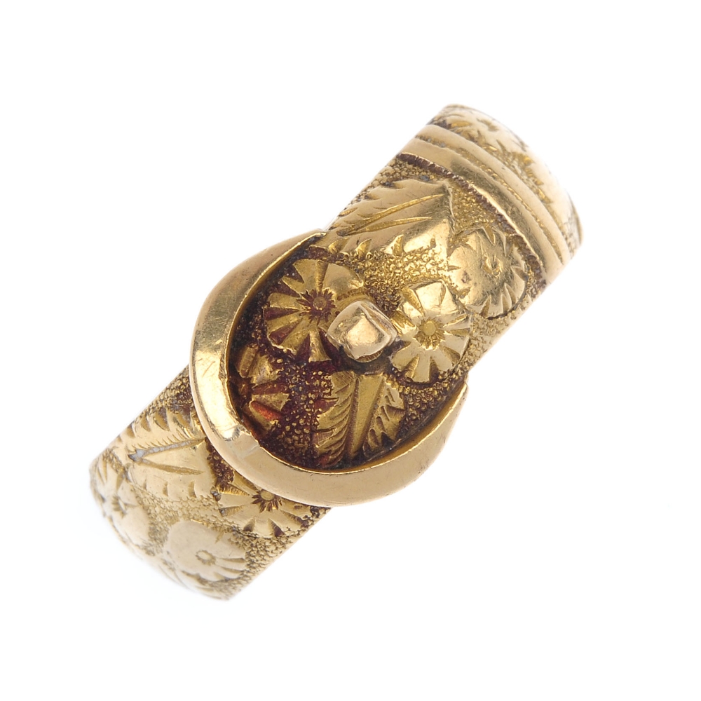 A late Victorian 18ct gold buckle ring. Designed as a belt, with floral texture. Hallmarks for