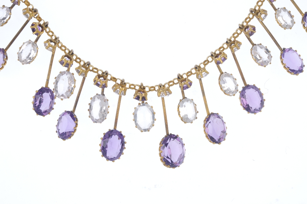 An amethyst and topaz fringe necklace. Designed as a series of graduated oval-shape amethyst and - Image 2 of 3