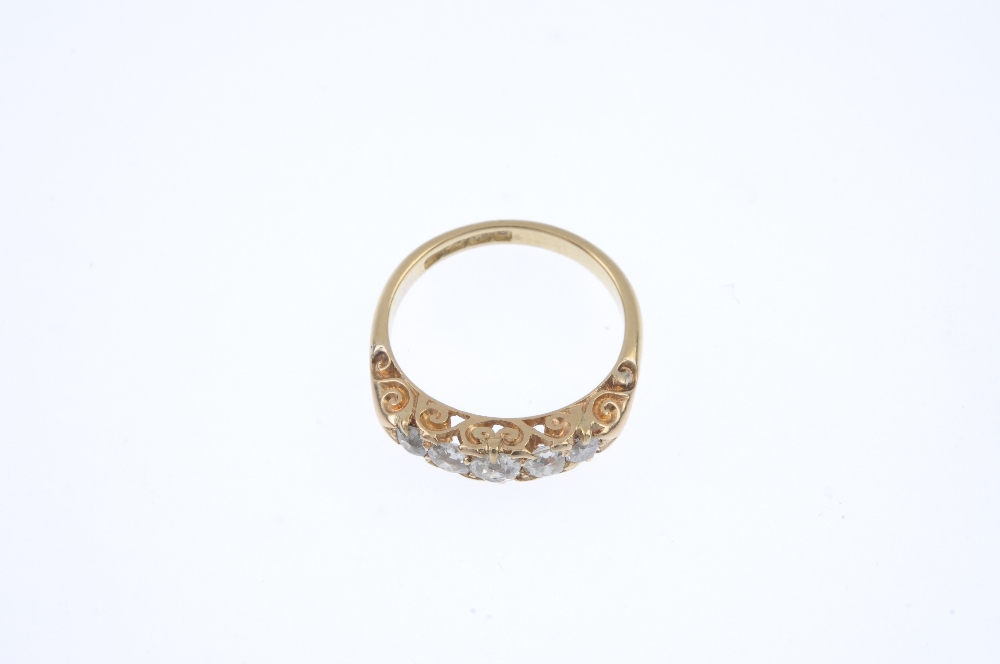 An Edwardian 18ct gold diamond five-stone ring. The graduated old and brilliant-cut diamond line, to - Image 2 of 4