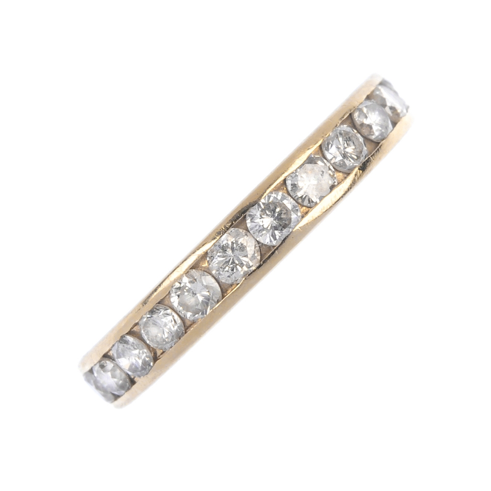 A diamond half-circle eternity ring. The brilliant-cut diamond line, inset to the plain band.