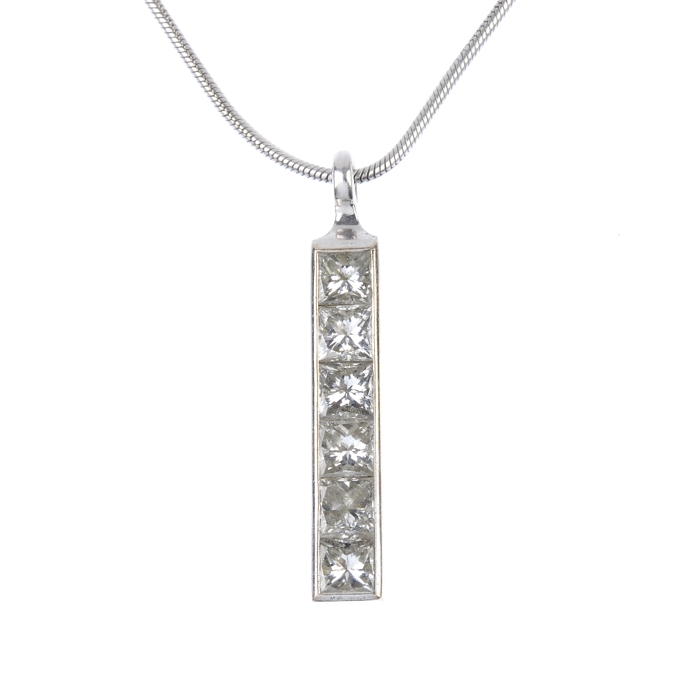 THEO FENNELL - a diamond pendant. The square-cut diamond line, within a plain surround, to the